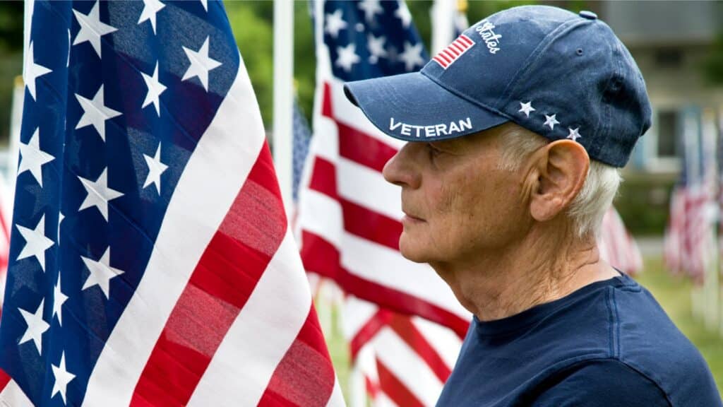 Veteran by an American Flag